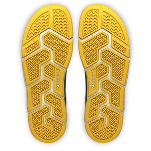 Undersida av Joe Nimble Addict barfotasko i färgen grön/gul, med gul yttersula i slitstarkt Michelin-gummi. Sulmönstret har flera flexzoner och greppsegment för stabilitet, grepp och naturlig fotrörelse vid gång och löpning.